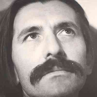 Yannis sporting a big moustache.